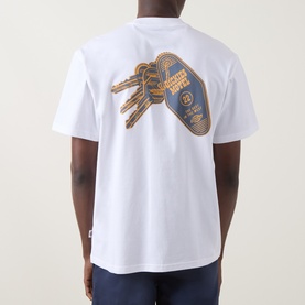 Model wearing Dickies white crew neck T-shirt, back view showing graphic hotel keychain print in gold and navy.