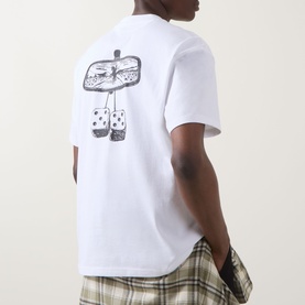 Model wearing Dickies white crew neck T-shirt, back view showing rearview mirror graphic print with hanging dice design, styled with checked trousers
