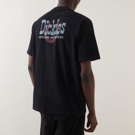 Model wearing Dickies black cotton crew neck T-shirt, back view showing Dickies Genuine Workwear graphic print logo.