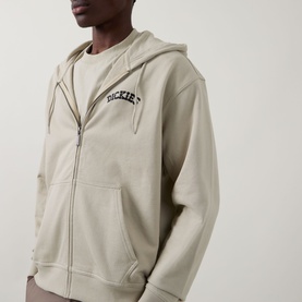 Model wearing Dickies Bettsville Logo Zip Hoodie in Eucalyptus, showing chest logo embroidery, zip fastening and pouch pocket.