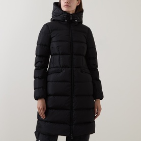 Model wearing Moncler black quilted down coat with hood, longline silhouette and front pockets