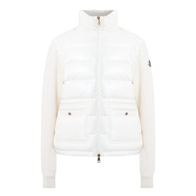 Moncler natural cardigan with quilted down front panels, zip fastening, side pockets, and ribbed knit sleeves with logo badge