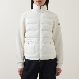 Model wearing Moncler natural cardigan with quilted padded front panel, knit sleeves, zip fastening and front pockets