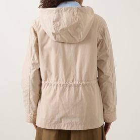 Model wearing Moncler beige hooded jacket, back view, showing elasticated waist, zip fastening and cotton-polyester construction