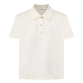 Moncler cream cotton polo top with short sleeves, collared neckline, and gold-tone buttons