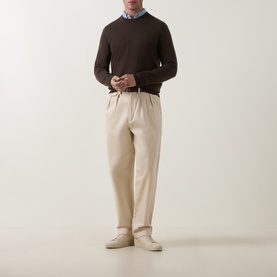 Model wearing Paul Smith Brown Merino Wool Crew Neck jumper, styled with cream trousers and light blue shirt, cream trainers.