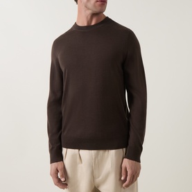 Model wearing Paul Smith Brown Merino Wool Crew Neck jumper, styled with cream wide-leg trousers.