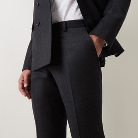 Model wearing Paul Smith charcoal wool-cashmere formal trousers, styled with matching charcoal blazer and white shirt.
