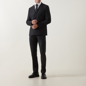 Model wearing Paul Smith Charcoal Formal Trousers in wool-cashmere blend, styled with matching double-breasted jacket, white shirt and black tie.