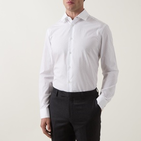 Model wearing Paul Smith white slim fit single cuff cotton formal shirt with dark trousers, spread collar visible.