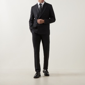 Model wearing Paul Smith white single cuff slim formal shirt, styled with black double-breasted suit, dark tie and black loafers.