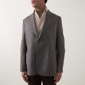 Model wearing Paul Smith charcoal wool-cashmere blazer jacket, styled with cream rollneck and dark trousers. Two-button single-breasted fit.