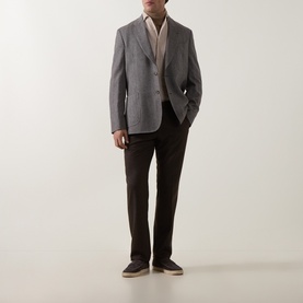 Model wearing Paul Smith charcoal wool-cashmere jacket with cream knitwear, dark brown trousers and grey suede loafers.