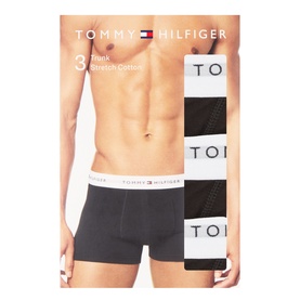 Tommy Hilfiger Three-Pack Signature Logo Trunks in black, shown on model and in packaging with branded elasticated waistband