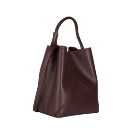 Victoria Beckham Victoria Bucket Bag in dark burgundy leather, single top handle, geometric panel stitching, gold-tone hardware detail