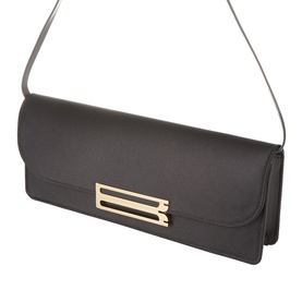 Victoria Beckham black clutch bag with gold-tone bar hardware closure, slim shoulder strap, structured rectangular silhouette