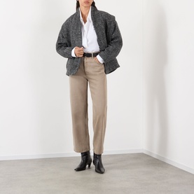 Model wearing AgoldE Trail wide leg jeans in tan, styled with a grey textured blazer, white shirt, and black ankle boots.