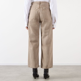 Model wearing AgoldE Wide Leg jeans in Trail, rear view, shown with white shirt and black ankle boots