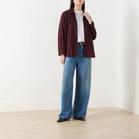 Model wearing AgoldE Rounded Baggy Wide-Leg Jeans in Expression mid-wash denim, styled with a burgundy blazer and white top.