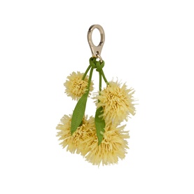Christian Louboutin bag charm with yellow raffia pom-pom flowers, green leaves, and gold-tone lobster clasp clip