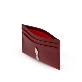 Christian Louboutin red leather card holder with red interior, silver logo detail, and multiple card slots, shown open at an angle.
