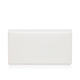 Christian Louboutin white smooth leather continental wallet, flat lay showing clean fold-over flap design and structured rectangular silhouette.