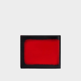Christian Louboutin red and black bifold wallet, compact card holder style with contrasting red interior panel visible.
