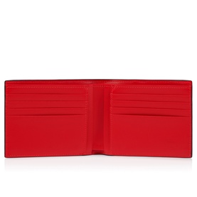 Christian Louboutin red leather bifold wallet, open view showing multiple card slots and smooth red interior lining