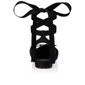 Christian Louboutin black suede lace-up flat sandal, rear view showing ribbon ankle tie and red sole detail