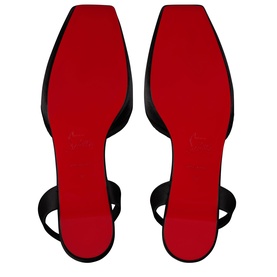 Christian Louboutin black mules shown sole-up, revealing signature red lacquered outsoles with ankle strap detail visible