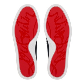 Christian Louboutin shoe soles in marine, featuring signature red outsoles with embossed script branding and white rubber edge