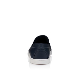 Christian Louboutin men's slip-on shoe in marine navy leather, heel view, with white flat sole.