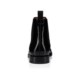 Christian Louboutin black leather Chelsea boot, rear view, elastic side panel, signature red sole, block heel