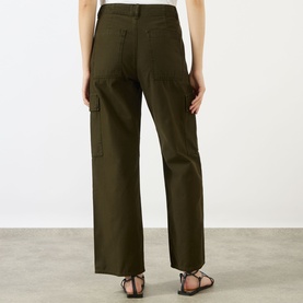 Model wearing Citizens of Humanity Moss straight cargo trousers, back view, styled with black strappy sandals