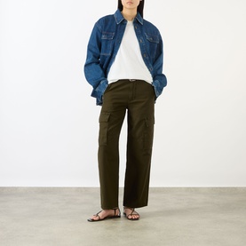 Model wearing Citizens of Humanity Moss straight cargo trousers styled with a blue denim overshirt and white tee, black flat sandals.