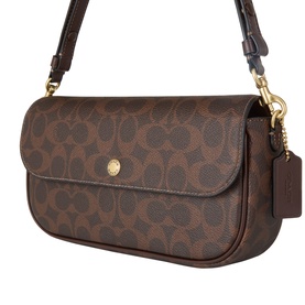 Coach crossbody bag in maple brown signature coated canvas with gold-tone hardware and adjustable shoulder strap