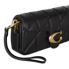 Coach black quilted leather crossbody bag with gold-tone hardware, chain and wrist strap detail, and signature C turnlock closure