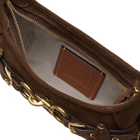 Coach dark chocolate leather shoulder bag interior view, gold-tone chain detail and zip, beige lining with branded patch pocket