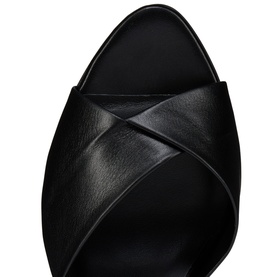 Christian Louboutin black leather mule with crossover strap detail, open toe, shot from above showing vamp and insole