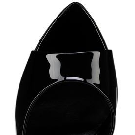 Christian Louboutin women's shoe in black patent leather, close-up of pointed toe with suede contrast detail and white piping edge