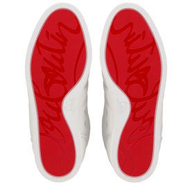 Christian Louboutin white trainers sole view showing signature red outsole with embossed script logo detailing