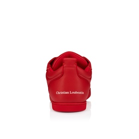 Christian Louboutin red leather sneaker, rear view showing branded heel tab and iconic red sole.