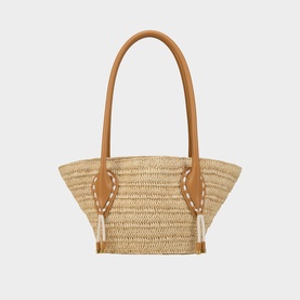 Christian Louboutin woven straw tote bag with tan leather handles and white lace detailing on sides