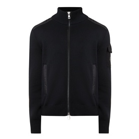 Moncler black zip-through cardigan with funnel neck, arm badge patch, and textured panel inserts