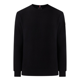 Black crew neck sweatshirt with ribbed cuffs and hem, small red and white tab detail at back neckline