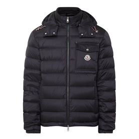 Moncler black quilted down jacket with detachable hood, front zip fastening, chest pocket, and logo badge.