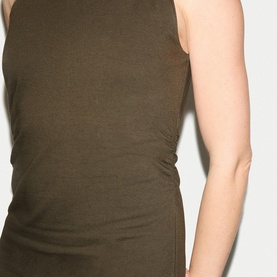 Model wearing Jigsaw khaki sleeveless ribbed fitted top, close-up of torso showing ruched side detail.