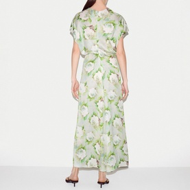 Model wearing Jigsaw green floral print maxi dress with short sleeves and wrap-style front, shown from the back.