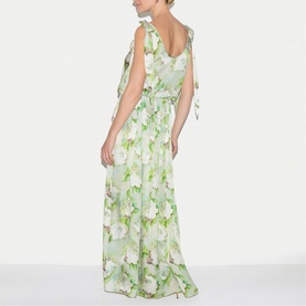 Model wearing Jigsaw green floral maxi dress with tie shoulders, fitted waist, and flowing tiered skirt