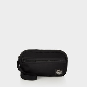 Stone Island black polyurethane crossbody bag with front zip pocket, wrist strap, and silver compass badge logo.